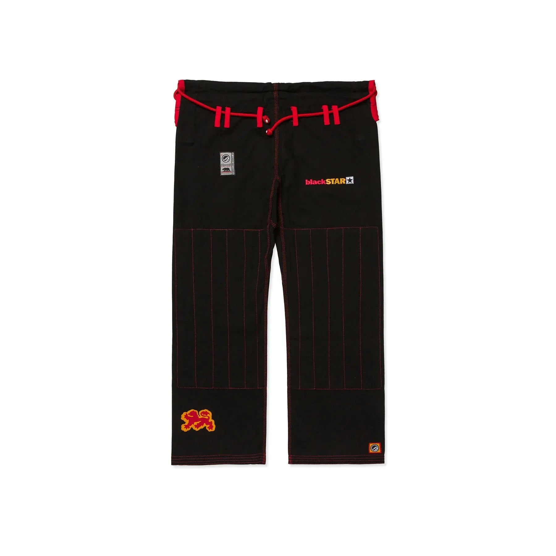 Black pants with red accents and logos on a white background