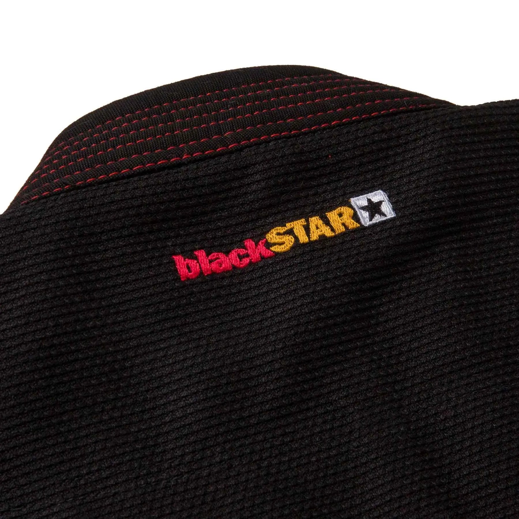 Black Star logo on a textured black surface